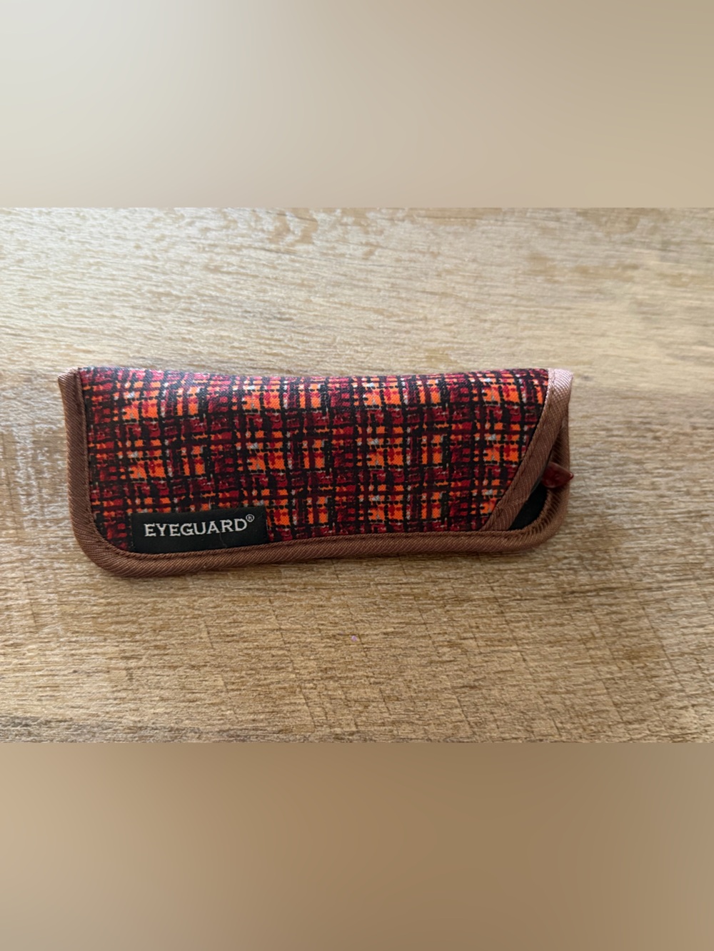 Red reading glasses w/plaid covers